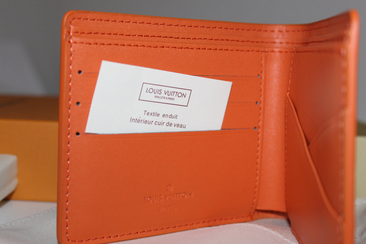 Louis Vuitton Multiple Wallet in orange LV Aerogram leather