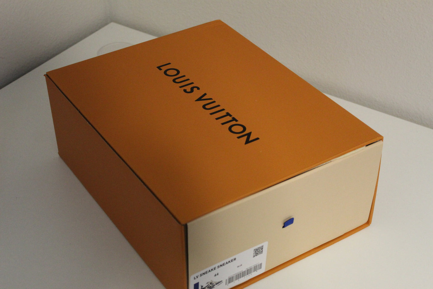 Louis Vuitton LV Skate Sneakers in a navy blue and white colorway.