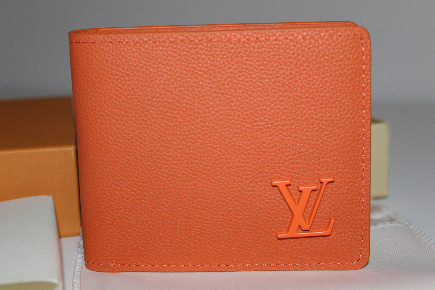 Louis Vuitton Multiple Wallet in orange LV Aerogram leather