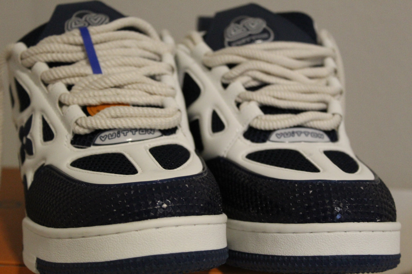 Louis Vuitton LV Skate Sneakers in a navy blue and white colorway.