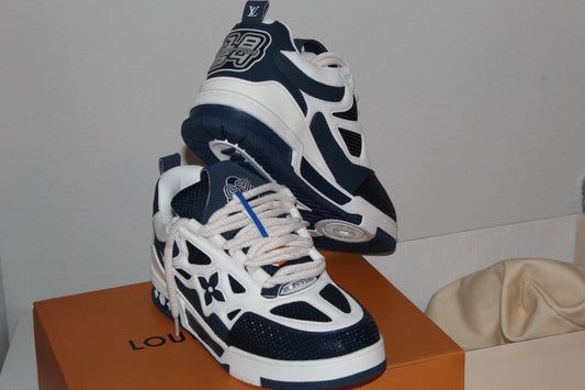 Louis Vuitton LV Skate Sneakers in a navy blue and white colorway.