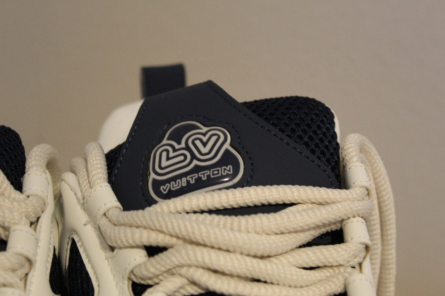 Louis Vuitton LV Skate Sneakers in a navy blue and white colorway.